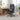 Black office chair in a room with a desk and large window