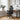 Black office chair in a modern office setting with a desk and decor.