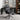 Black office chair in a home office setting with a desk and bookshelf.